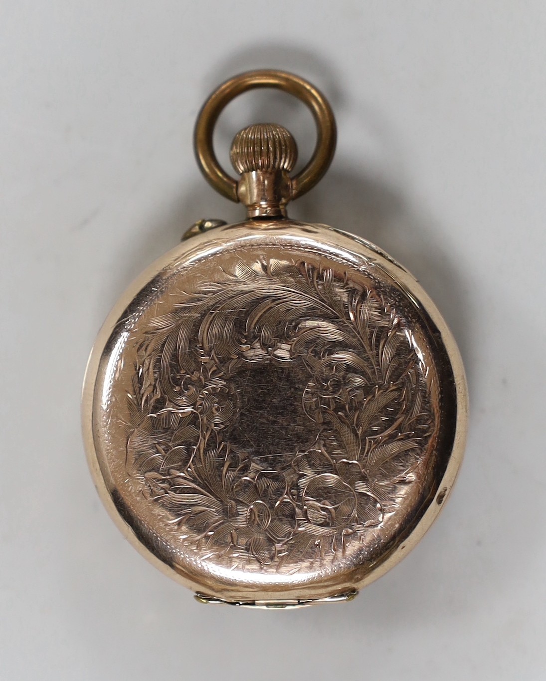 An engraved 9k open face keyless fob watch, with gilt metal inner cuvette, cased diameter 35mm, gross weight 34.6 grams.